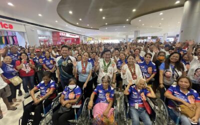 Senator Francis Tolentino leads the distribution of wheelchairs and financial assistance